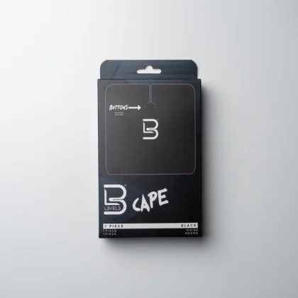 Capa de corte profesional negra L3VEL3 con cierre de botones ajustable.​